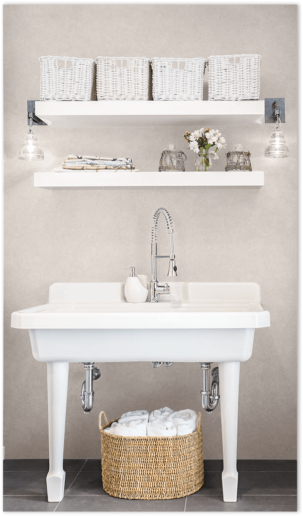 Taupe Tessera mosiac tiles wallcovering in a bathroom 24 May 2013 --- Wide white sink in bathroom --- Image by © Hero Images/Corbis