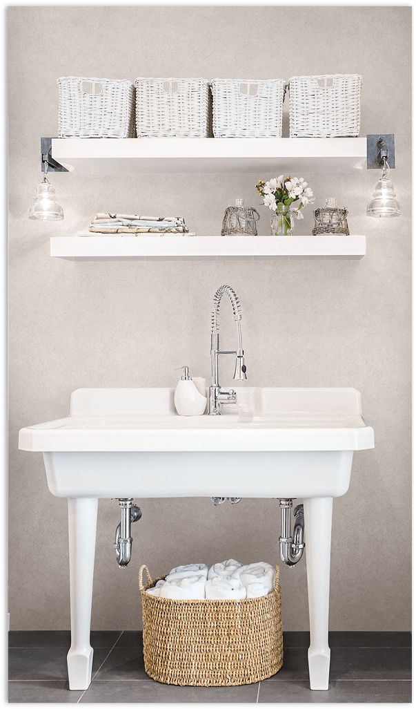 Taupe Tessera mosiac tiles wallcovering in a bathroom 24 May 2013 --- Wide white sink in bathroom --- Image by © Hero Images/Corbis